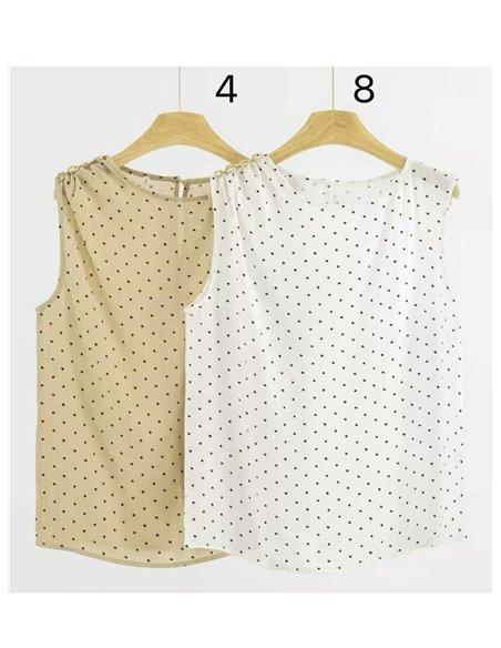 Blusa lunares sin manga detalle metálico en hombro
