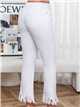 White flare jeans with frayed hem