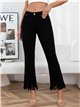 Jeans neri a zampa con frange