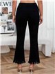 Jeans neri a zampa con frange