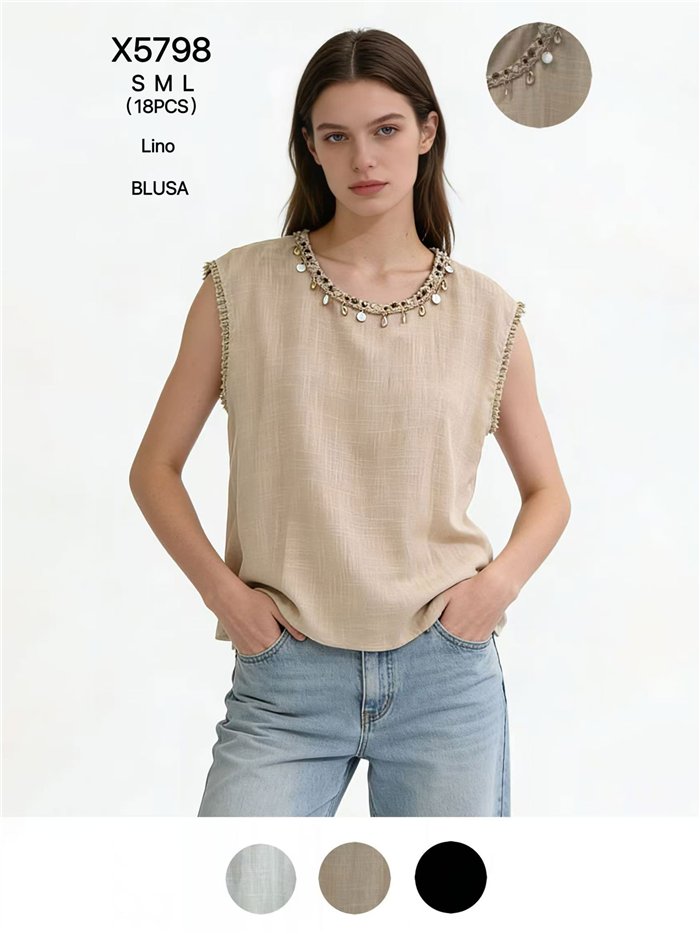 Blusa de lino con cuello conchas