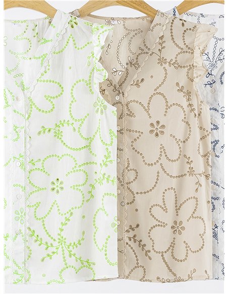 Chemisier en coton à fleurs, orné de détails ajourés et de volants.
