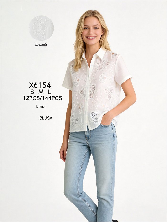 Camicia di lino ricamata con fiori traforati.