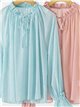 Blusa plumeti semitransparente con lazada