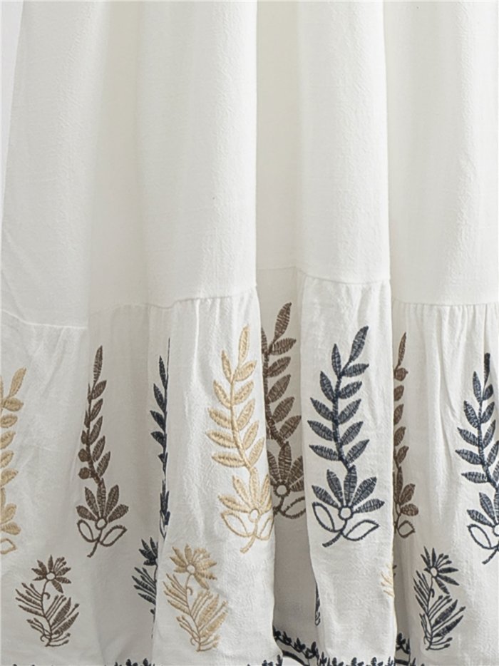 Vestido midi boho con bordado y borlas