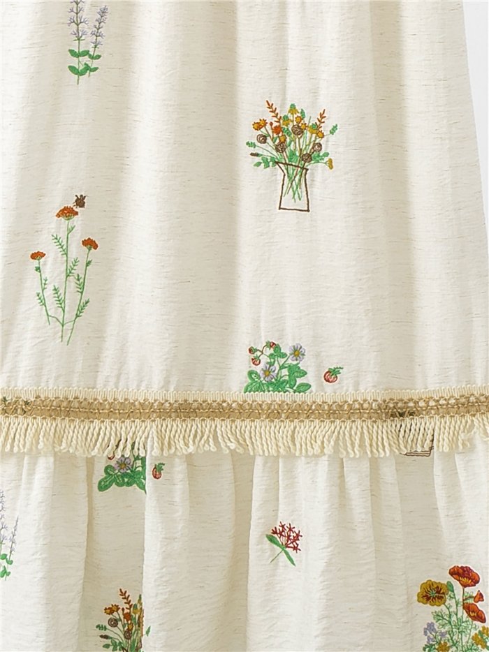 Vestido midi de tirantes con bordado floral y flecos