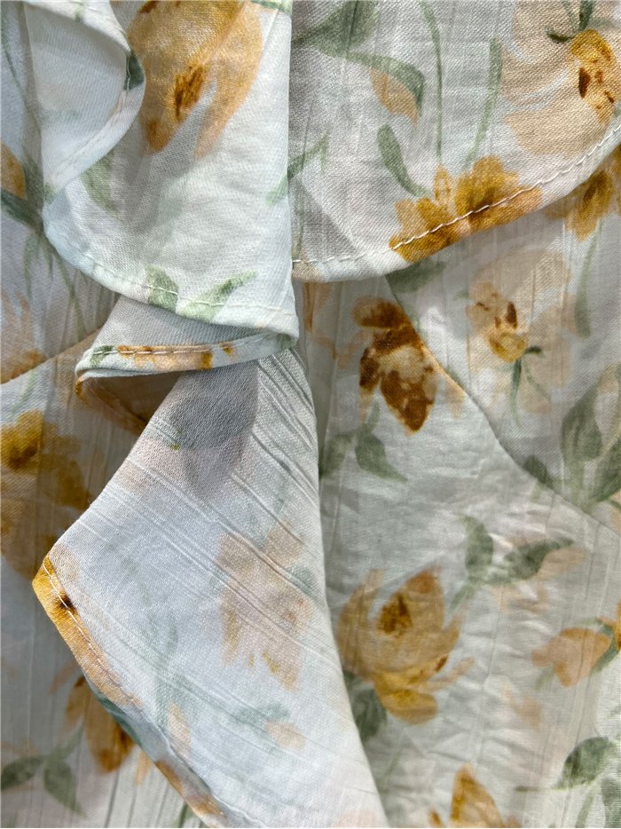 Top floral con volante