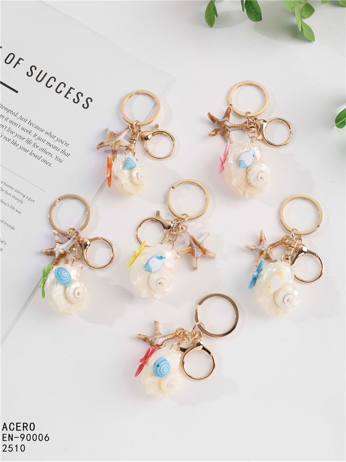 Llavero concha marina efecto natural con estrella y pez