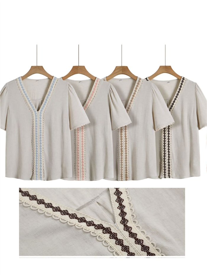 Blusa de linho bordada com mangas curtas.