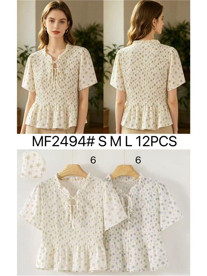 Blusa floreale arricciata con peplo
