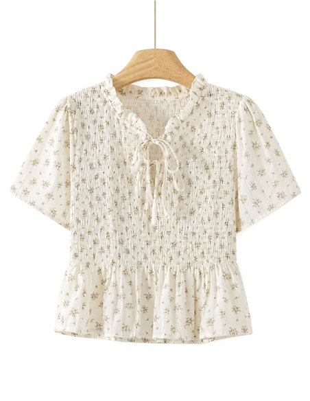 Blusa floreale arricciata con peplo