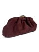 Gathered evening clutch with metallic clasp