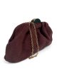 Gathered evening clutch with metallic clasp
