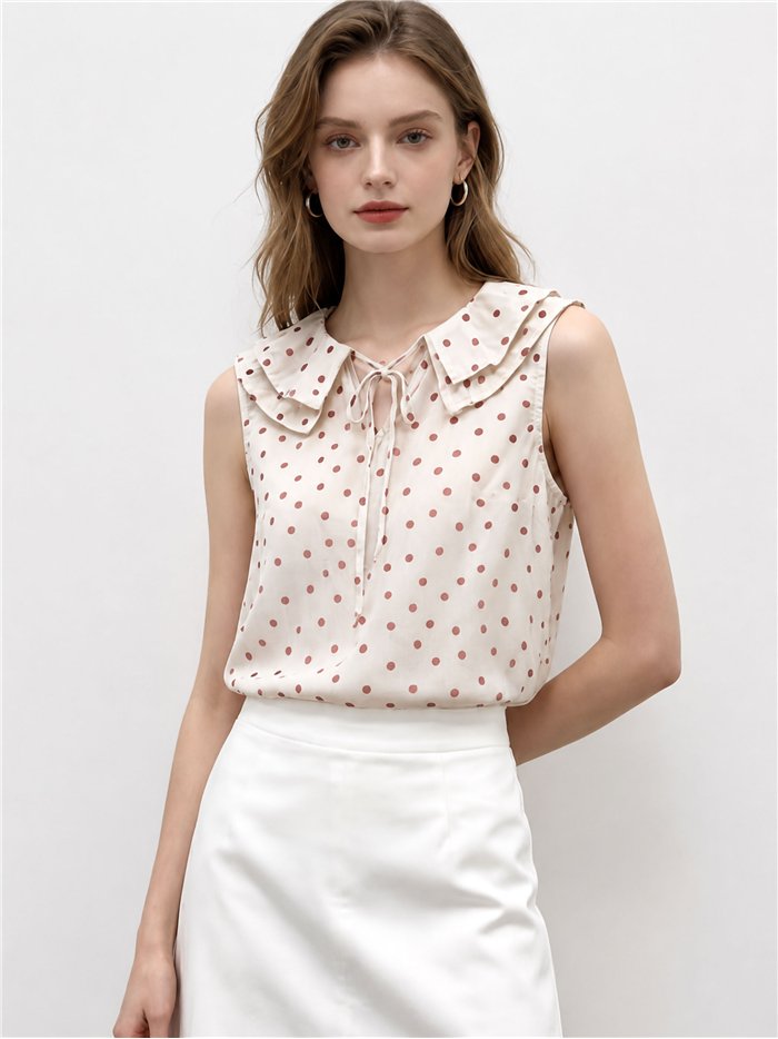 Blusa lunares sin mangas con cuello bobo