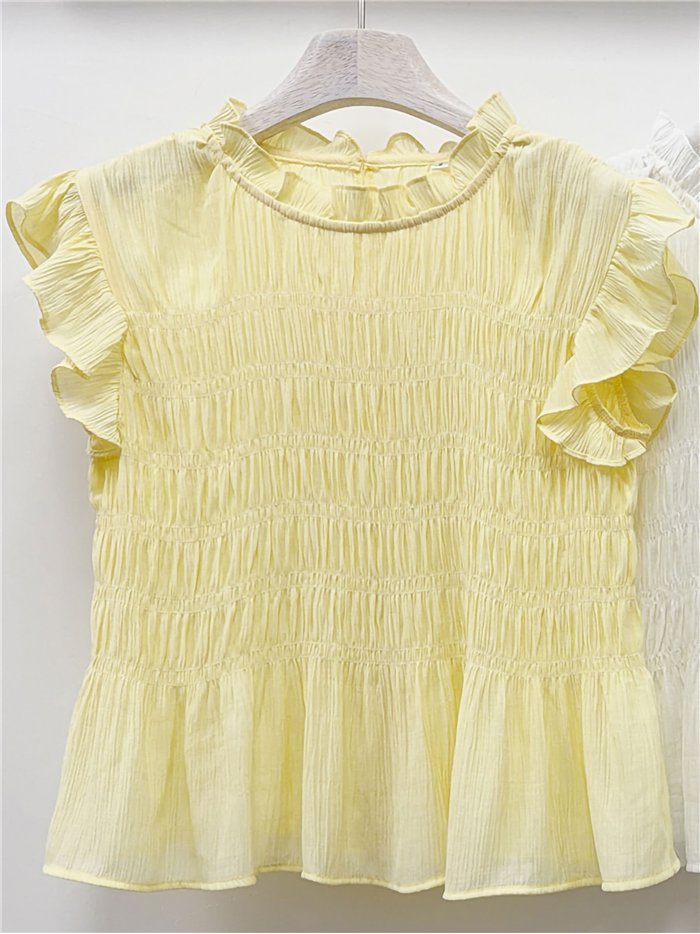 Blusa nido de abeja con volantes
