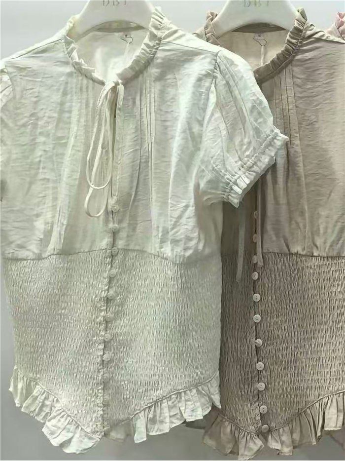 Camicetta arricciata con fiocco
