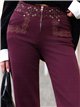 Jeans a gamba larga con elastico in vita ricamato e occhielli