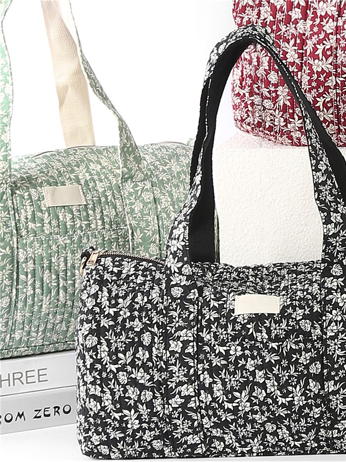 Floral quilted travel bag with strap