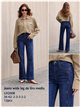 Weit geschnittene Jeans mit seitlicher Stickerei