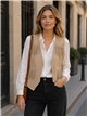 Chaleco efecto ante con flecos y tachas