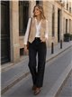 Chaleco efecto ante con flecos y tachas