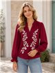 Blusa bordada con cuello volante