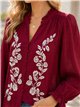 Blusa bordada con cuello volante