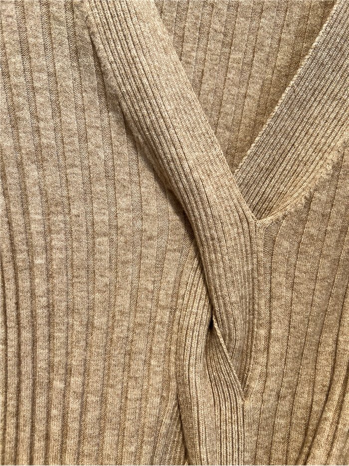 Jersey canalé detalle cruzado con trenza