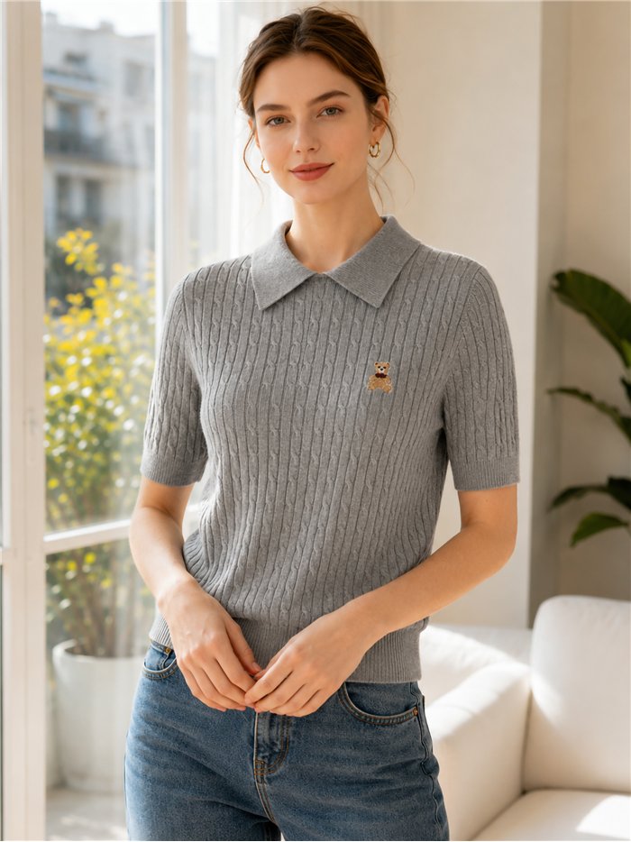 Jersey de punto trenzado con osito cuello polo