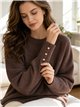 Jersey soft con botones dorados en puño