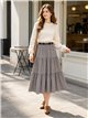Falda midi de cuadros con volantes