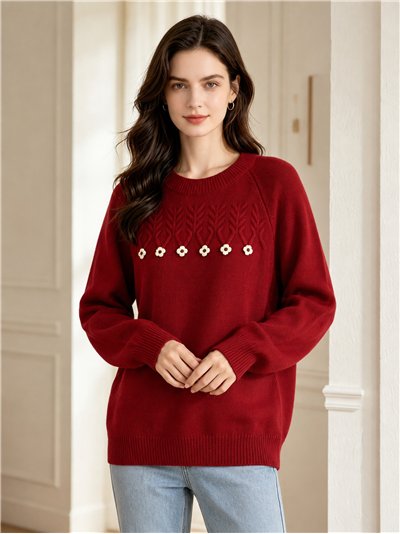 Suéter oversized de tricô com aplicações de flores.