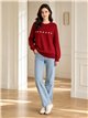 Pull oversize en maille torsadée avec fleurs appliquées