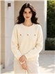 Jersey amplio con flores aplicadas