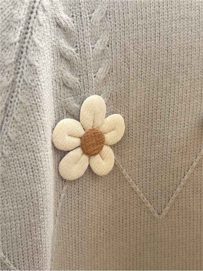 Jersey amplio con flores aplicadas