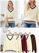 Pull oversize à col en V en maille torsadée avec détails contrastés