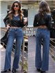 Weit geschnittene Jeans mit sternförmigen Taschen