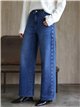 Jeans a gamba larga con occhielli laterali