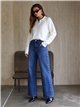 Jeans a gamba larga con occhielli laterali
