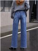 Jeans wide leg cintura cruzada tachuelas laterales