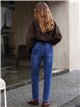 Jeans mom fit bajo vuelto
