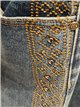 Jeans wide leg banda bordada con tachas