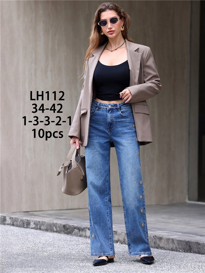 Jeans wide leg bordados de soles con tachas