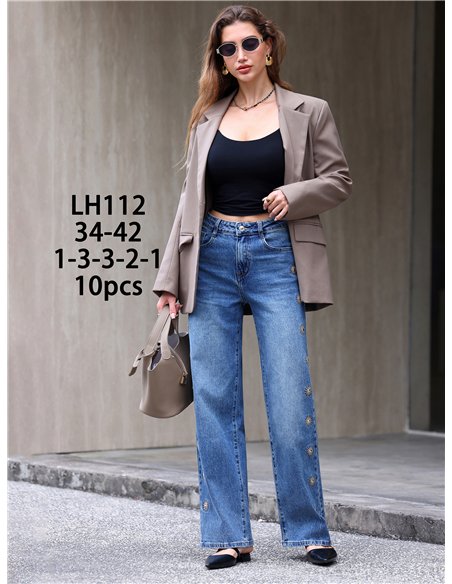 Jeans wide leg bordados de soles con tachas