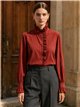 Blusa cuello alto volante