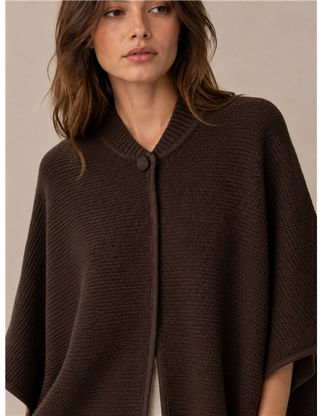 Poncho de punto botón