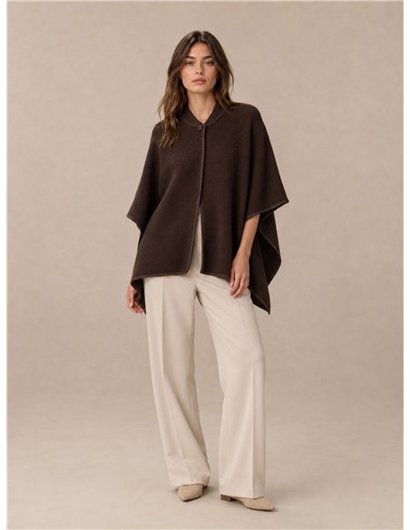Poncho de punto botón