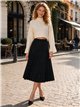 Falda midi plisada de punto con brillo