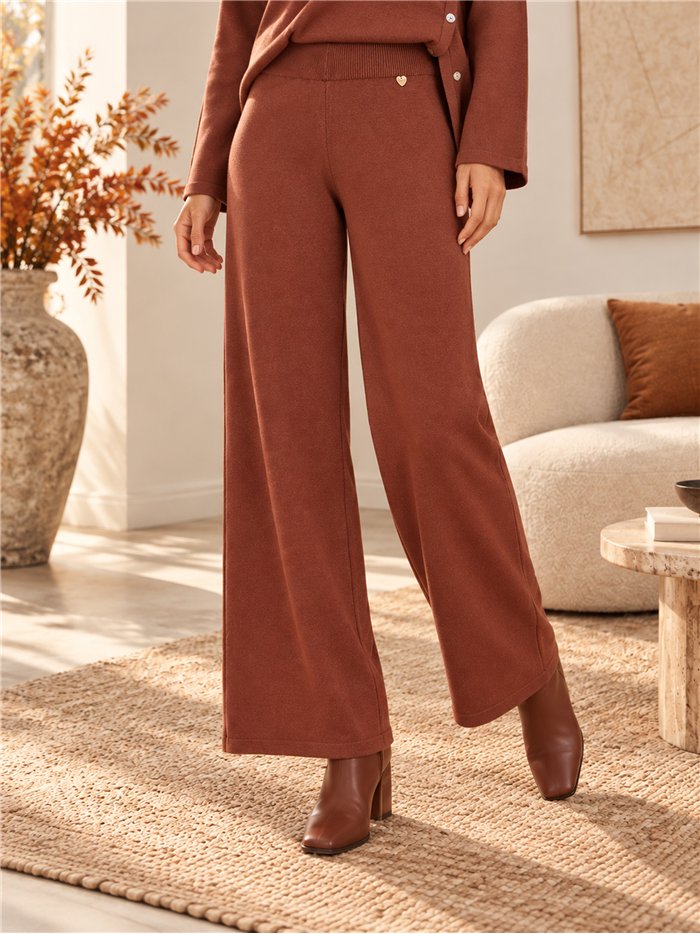 Completo composto da maglione e pantaloni con bottoni laterali
