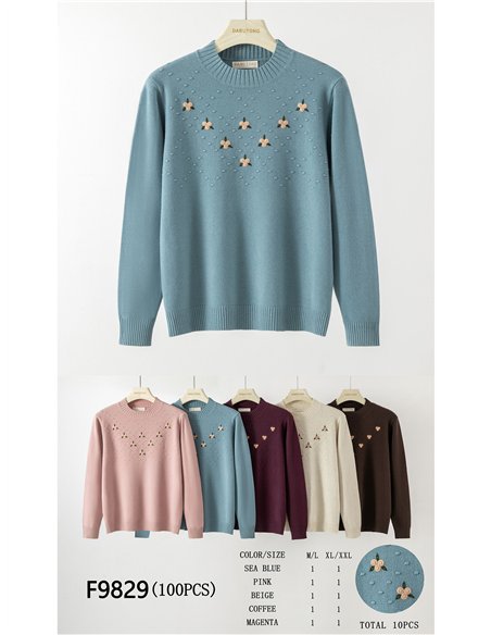 Maglia ricamata con motivi floreali
